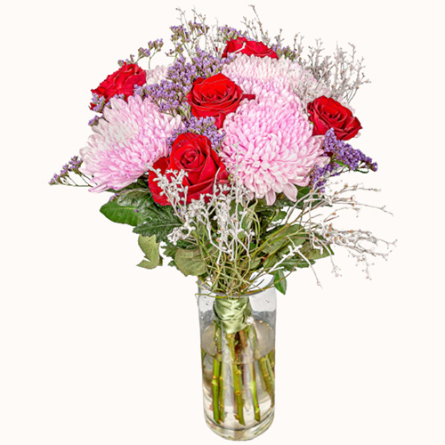 Pink and red 'Pink Champagne' flowers in a small glass vase