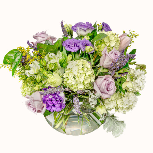 Multicoloured 'Poetry in Purple' flowers in a small glass vase
