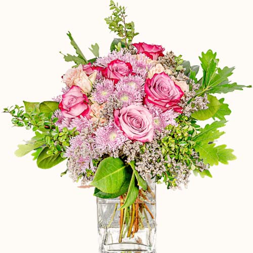 Pink 'Pretty in Pink' flowers in a small glass vase