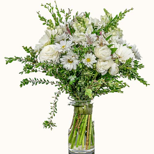 White 'Tender Clouds' flowers in a small glass vase